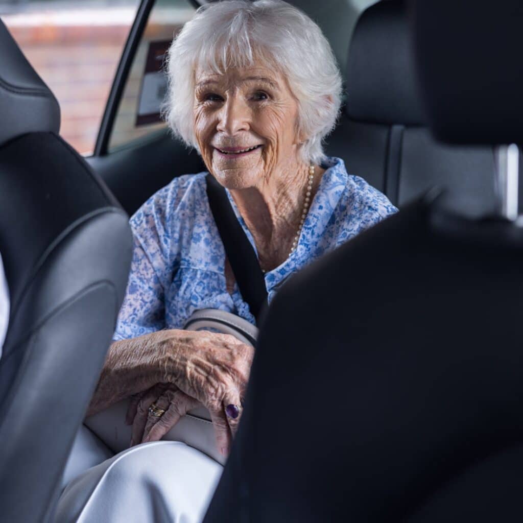 Senior passenger in a Black & White Cab